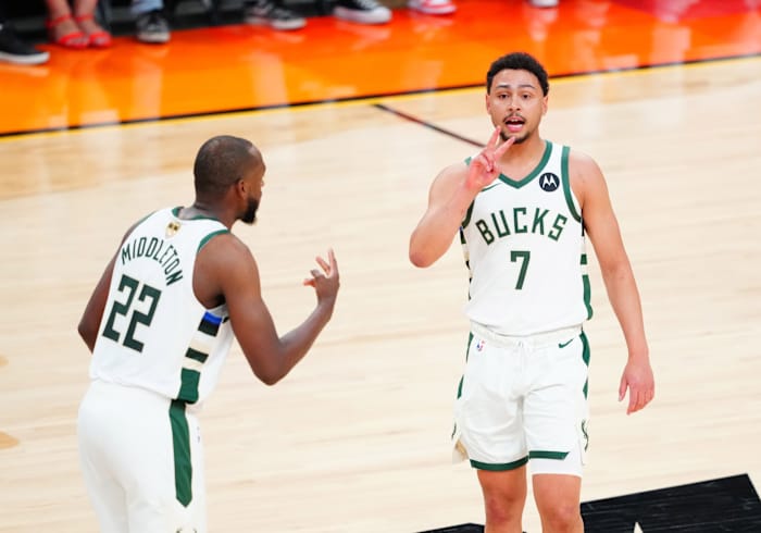 Milwaukee Bucks guard Bryn Forbes (7) and forward Khris Middleton (22) 
